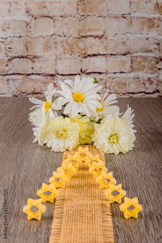 Jewish pasta for broth , a background of white flowers photo