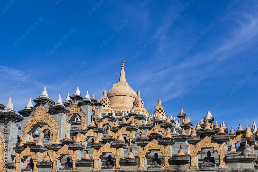 Sandstone pagoda in wat  Pa Kung temple at Roi Et of Thailand on blue sky