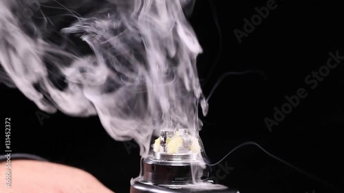 showing burn of juice or liquid in the coil, wire and cotton inside the atomizer of electronic cigarette for vaping, close up scene, high definition, Full HD, 1920x1080