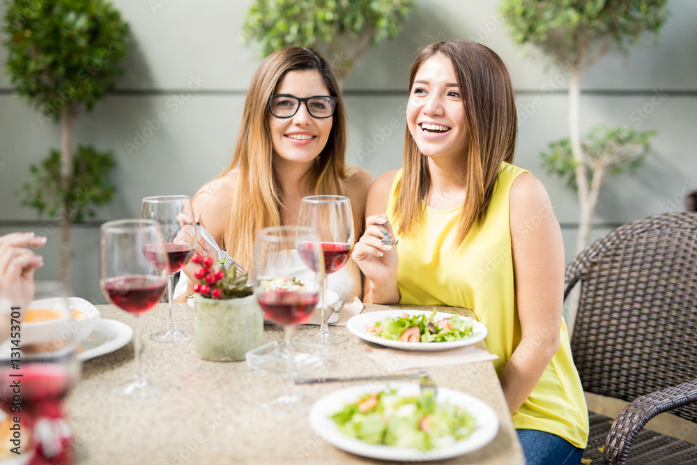 Female friends eating dinner together