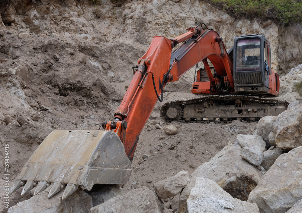 Excavator in stones Excavator in stones