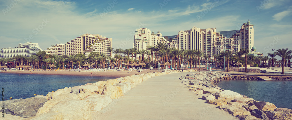 Fototapeta premium Relaxing atmosphere on the central public beach of Eilat - famous resort and recreational city in Israel 