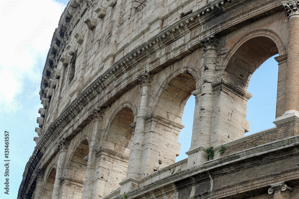 Fototapeta premium Coloseum details on a blue sky, Rome, Italy