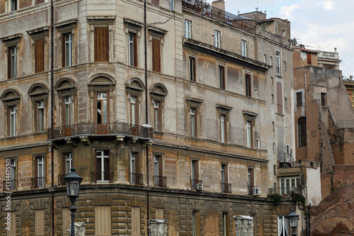 Building facade with windows, on blue sky, Rome, Italy