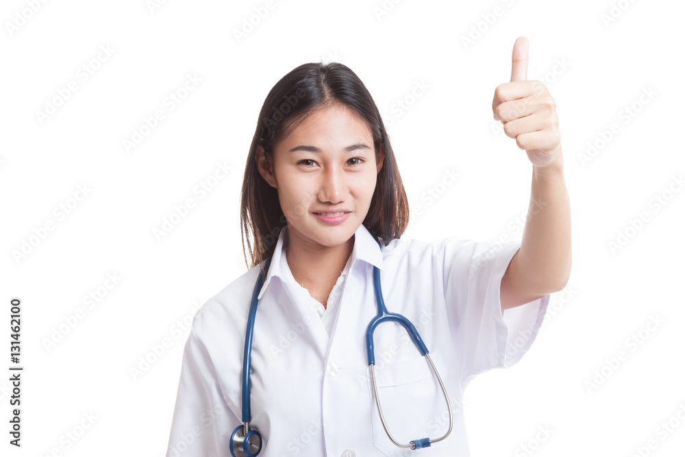 Young Asian female doctor show thumbs up. Young Asian female doctor show thumbs up.