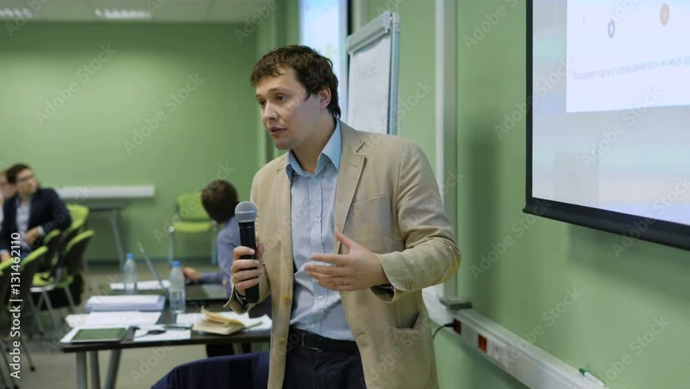 custom made wallpaper toronto digitalBusiness Coach shares his experiences with managers at a seminar, shows slides with the projector. Young man are actively discussing the event topic using a microphone.
