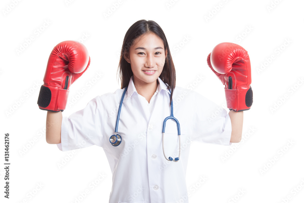 Young Asian female doctor guard with boxing glove. Young Asian female doctor guard with boxing glove.