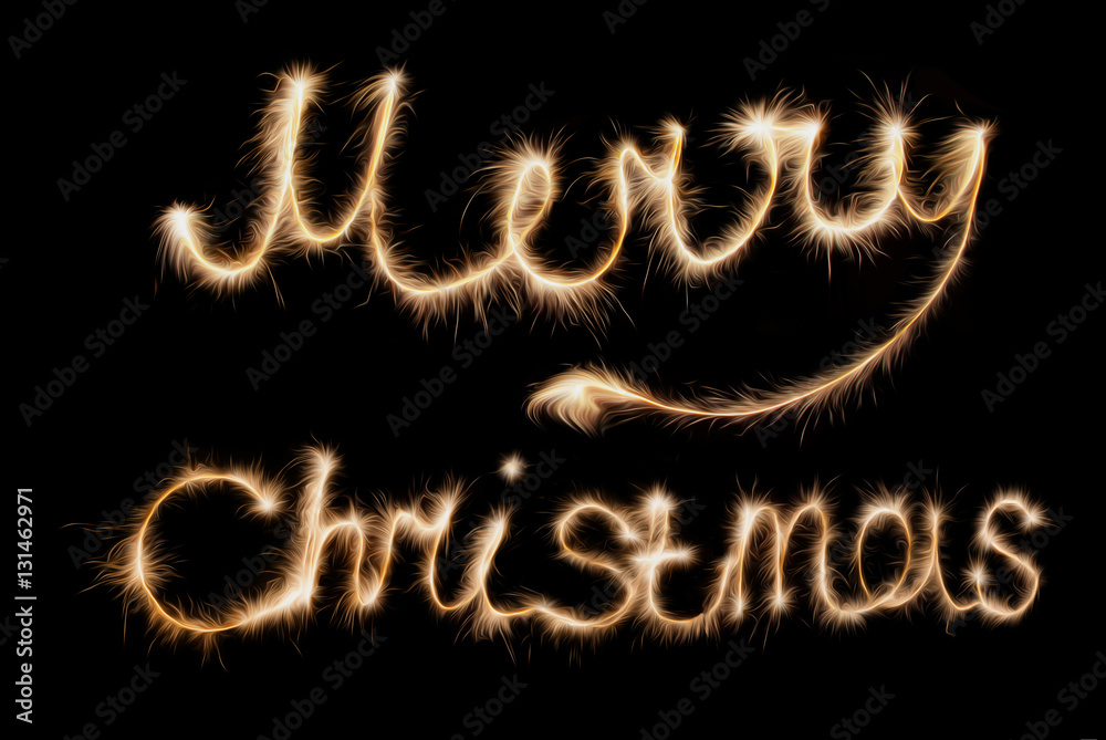 Merry Christmas . Inscription made sparklers on a dark background.