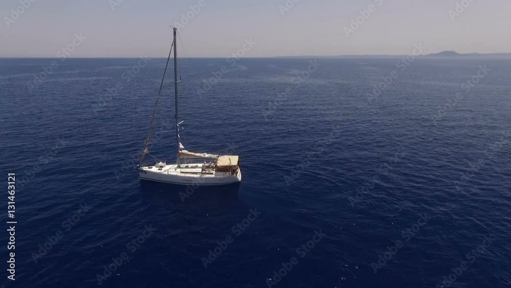 The yacht drifting in the sea. View from above The yacht drifting in the sea. View from above