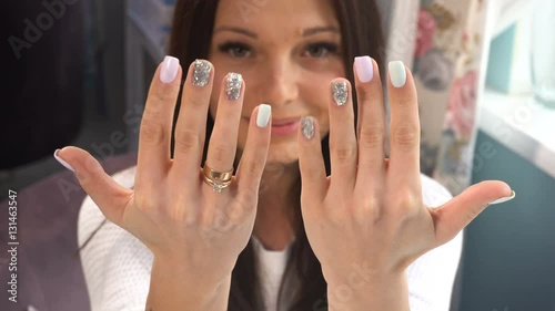 Beauty woman show her hands with manicure photo