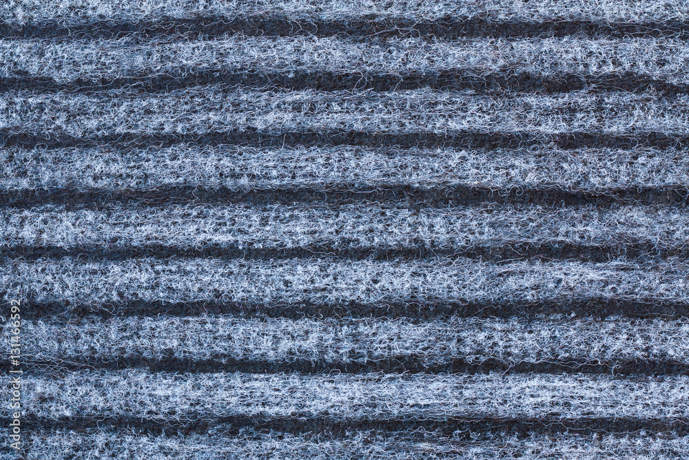 Background And Texture Of Striped Woolen Carpet Of Black, Gray And White Colors. Close Up. Background And Texture Of Striped Woolen Carpet Of Black, Gray And White Colors. Close Up.