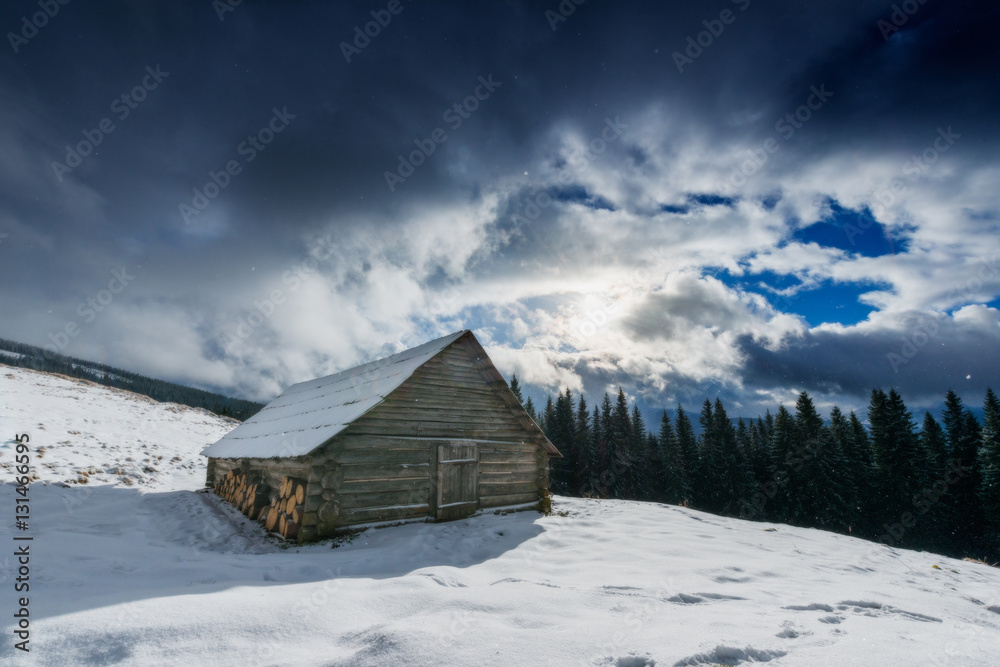 Carpathian mountain village covered with fresh snow. Sunny winte