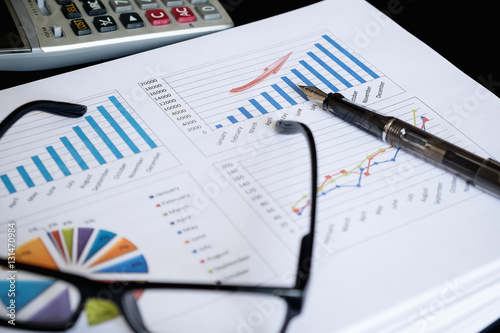 Tableau sur toile business documents on office table with laptop computer and grap