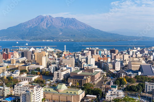Japan city skyline with Sakurajima Volcano photo