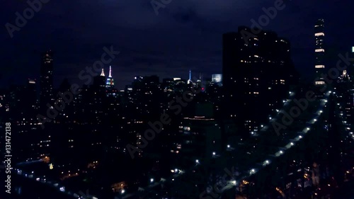 view of New York City flying back over Queensboro Bridge
