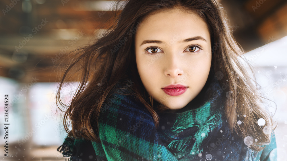 portrait of a beautiful young girl on the street in winter portrait of a beautiful young girl on the street in winter