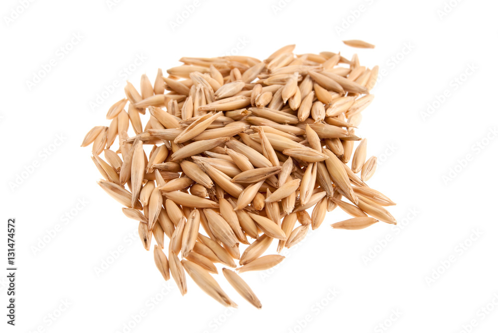 Heap of oat seeds isolated on white background