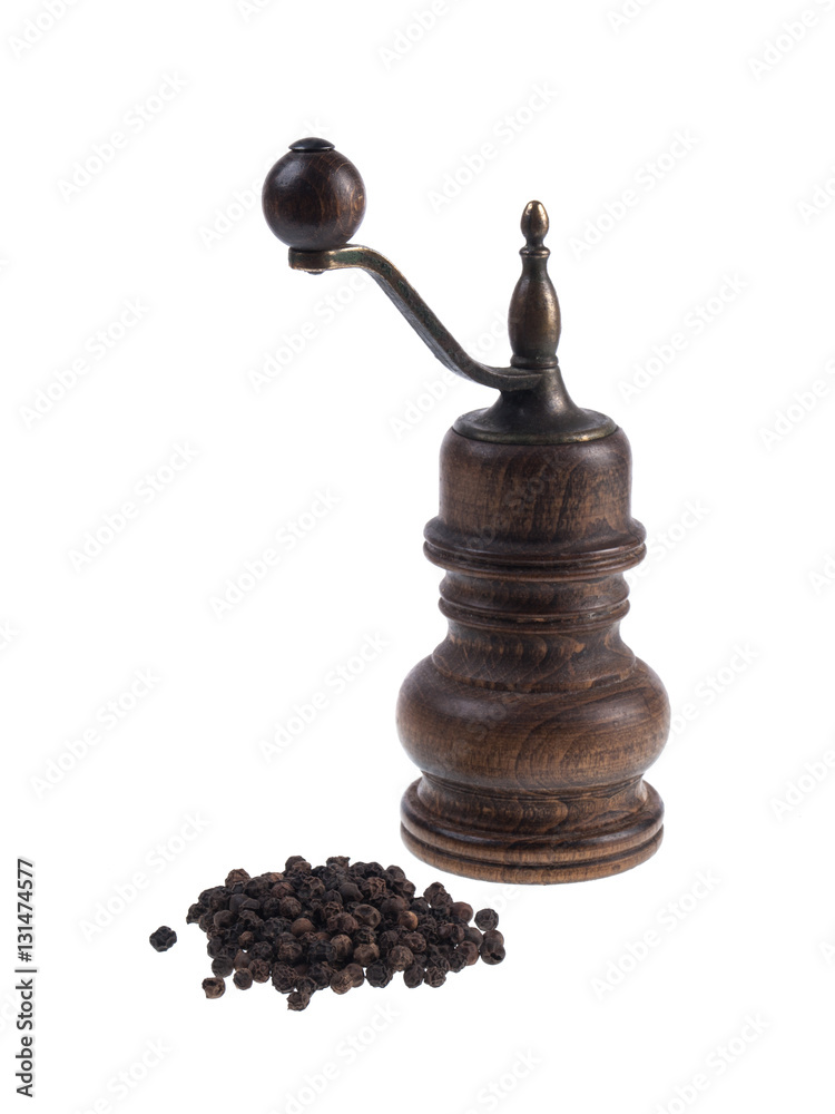 Mill for pepper with black peppercorns isolated on white background Mill for pepper with black peppercorns isolated on white background