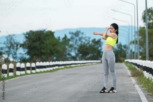 young woman runner warm up outdoor