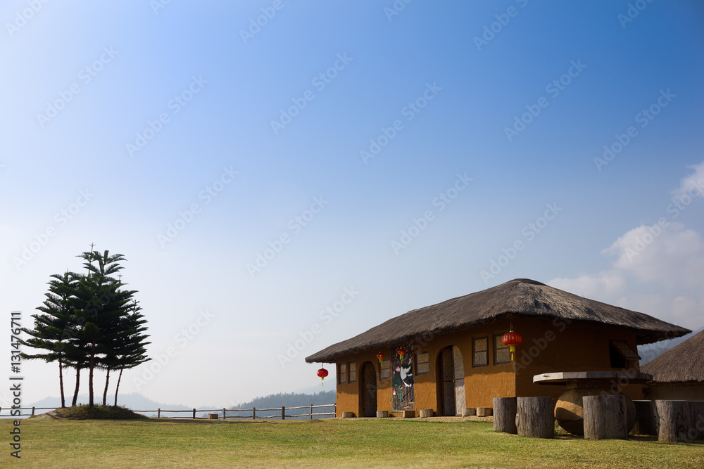 Fototapeta premium Chinese house with trees on top of mountain