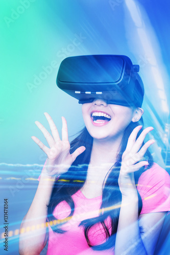 Happy woman watching virtual reality