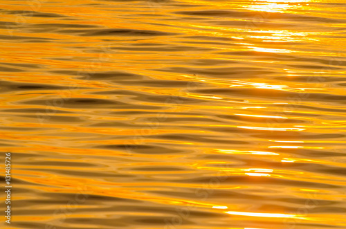 picture of the water surface in the sunrise time