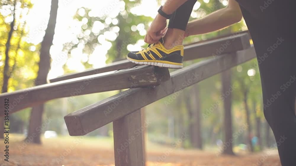 Tying running shoes and jogging in the park. Tying running shoes and jogging in the park.