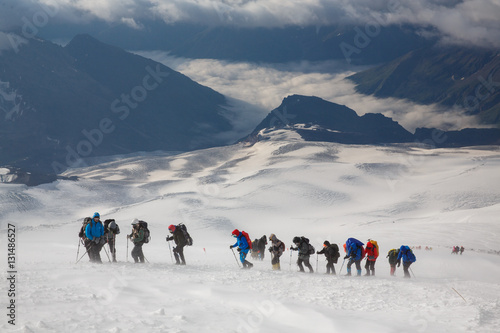 A group of alpinists in the snowy storm. Elbrus mountain, Russia