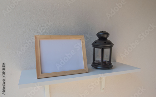 photo Frame on a wooden and Lantern on White background .