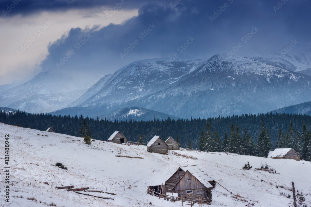 A large village in the Carpathian Mountains, snow-covered mounta