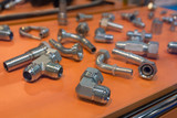 Variety of metal fittings for water on the counter. Industry