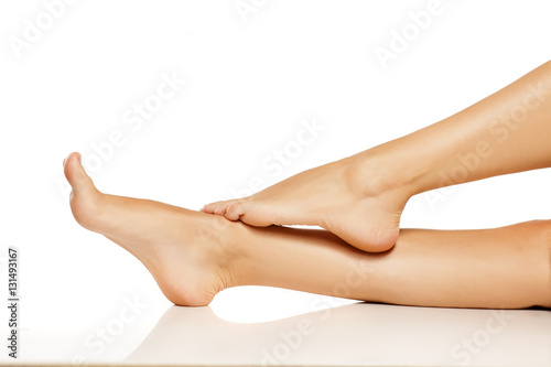 beautifully groomed woman feet and legs photo