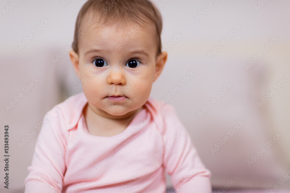 Cute little baby girl in pink / Portrait of a 8 months old baby girl wearing pink clothes