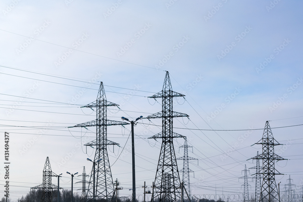 Several metal electricity pylon in the field. Several metal electricity pylon in the field.