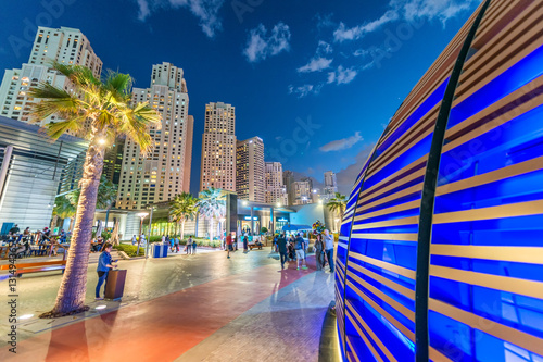 Photography Dubai Marina skyline with city promenade at dusk