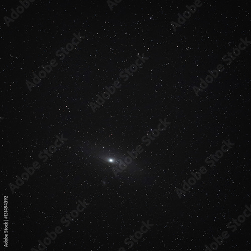 Night sky with stars and a spiral galaxy Andromeda.