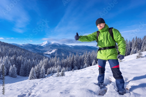 Tourist in winter mountains success, everything is OK!