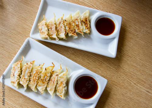 Asian appetizer menu fried dumplings with soy sauce Japanese tone photo