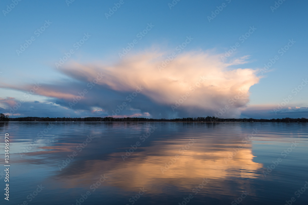 Sunlight on clouds over a lake