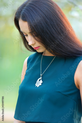 long hair beautiful woman with luxury jewelry necklace on neck.