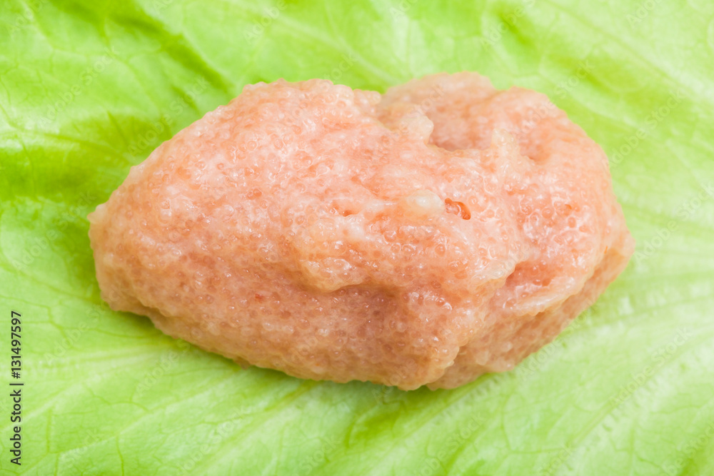 salty caviar of saffron cod on green leaf salty caviar of saffron cod on green leaf