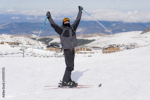 happy man happy in snow mountains at Sierrna Nevada ski resort in Spain