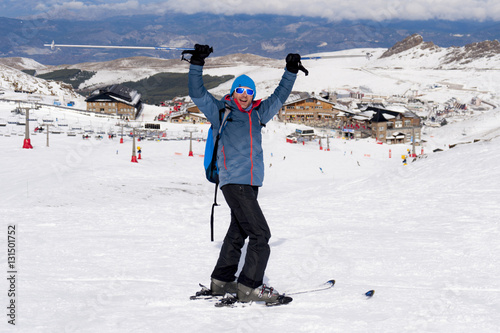 happy man happy in snow mountains at Sierra Nevada ski resort in Spain
