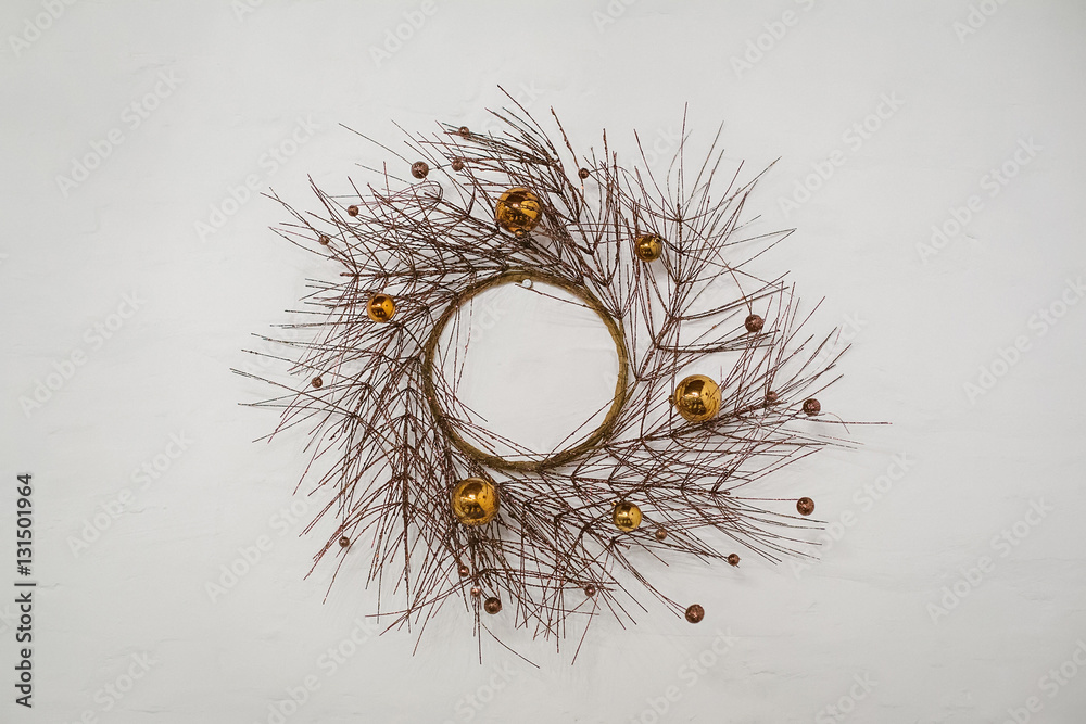 Fototapeta premium wreath of dry branches of a tree decorated with balls