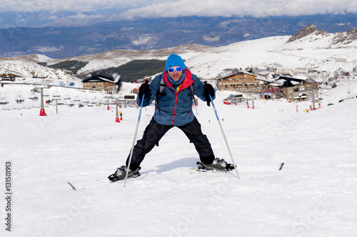 happy man happy in snow mountains at Sierra Nevada ski resort in Spain