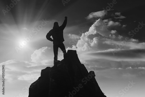 Hiker against the sun. Black and white