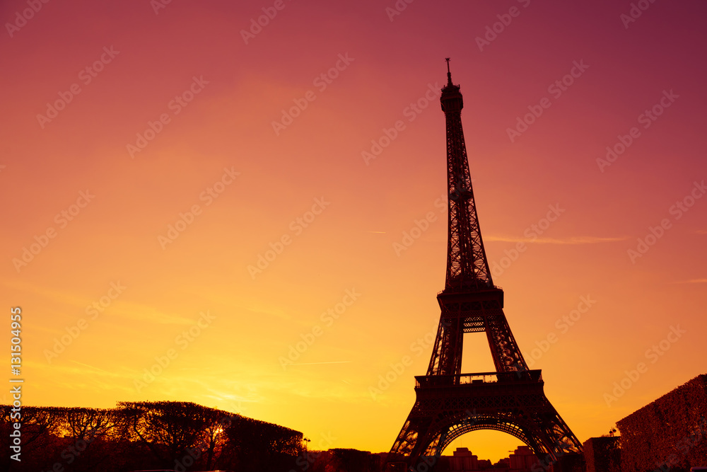 Obraz premium Eiffel Tower silhouette at evening sunset light in Paris France