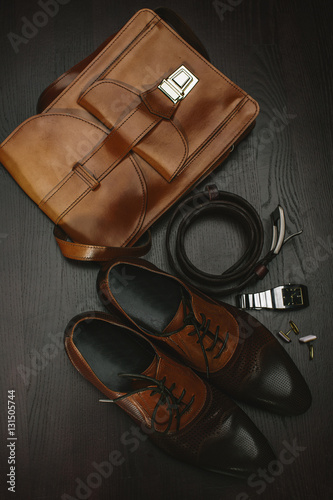 Male accessory. Shoes with handbag, belt and watch