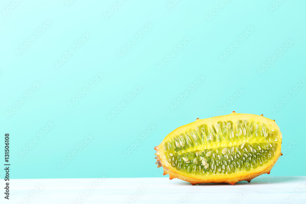 Kiwano fruit on white wooden table Kiwano fruit on white wooden table