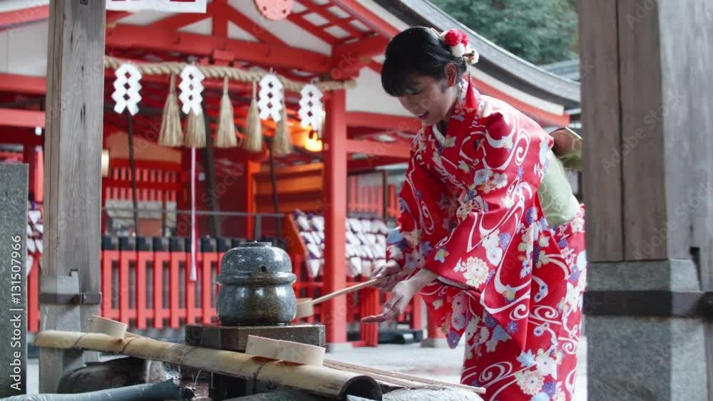 Beautiful Japanese scene women washing hands at the temple Kimono Inari Kyoto 